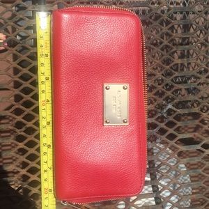 Michael Kors wallet. 8 credit slots, middle zipper